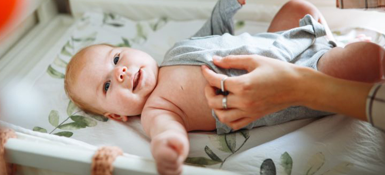 baby on changing table